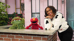 Elisabeth Moss, Elmo, Oscar the Grouch Elisabeth Moss, Elmo, Oscar the Grouch